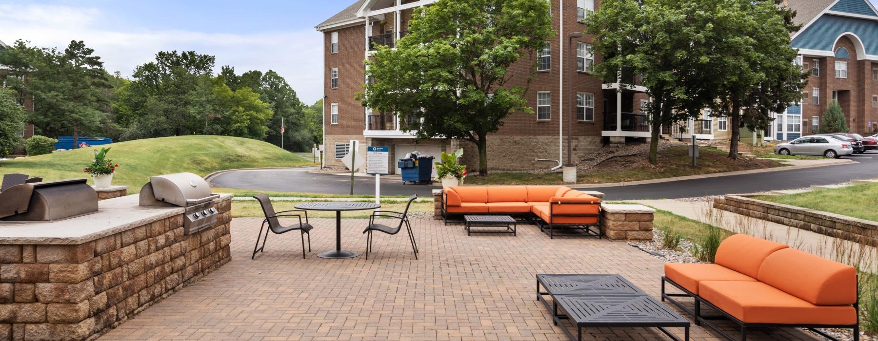 a brick patio with tables and chairs