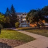 a building with a lawn and trees