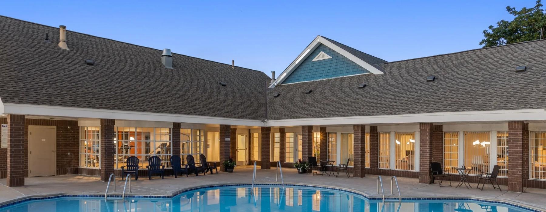 a swimming pool in front of a house
